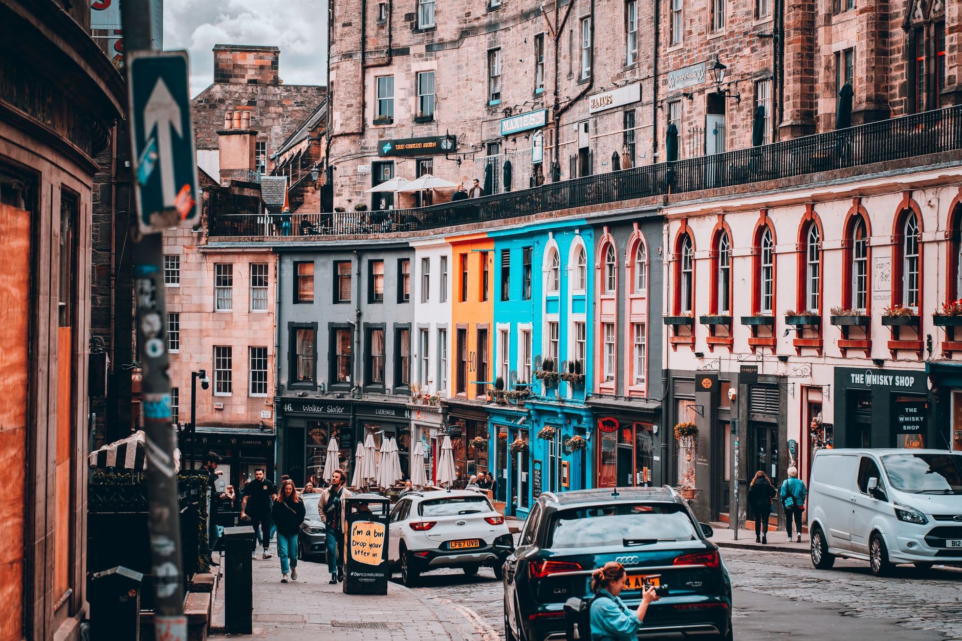 View of a colorful and bustling street in Edinburgh, capturing the essence of urban life.