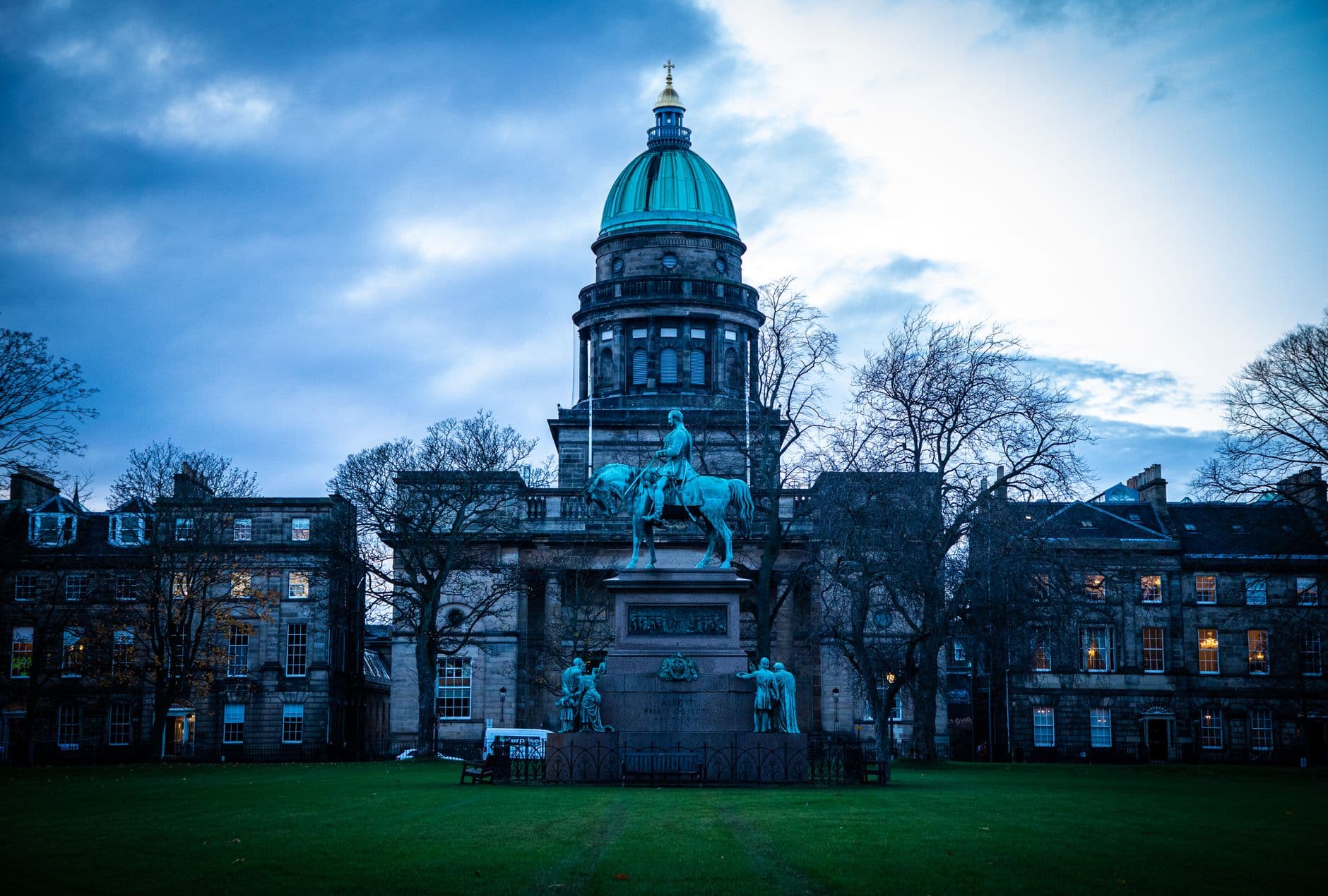 Stunning view of a historic equestrian statue at West Register House in Edinburgh during twilight.